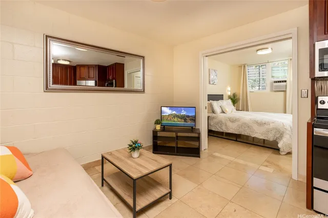 a bedroom with a bed and a view of bathroom