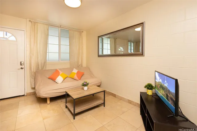a living room with furniture and a window