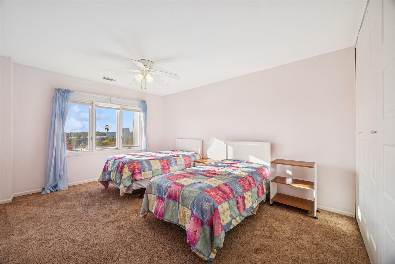 453 Raintree Drive, Unit 5A Glen Ellyn, IL 60137 - Photo 11 of 16 a bedroom with two beds and window