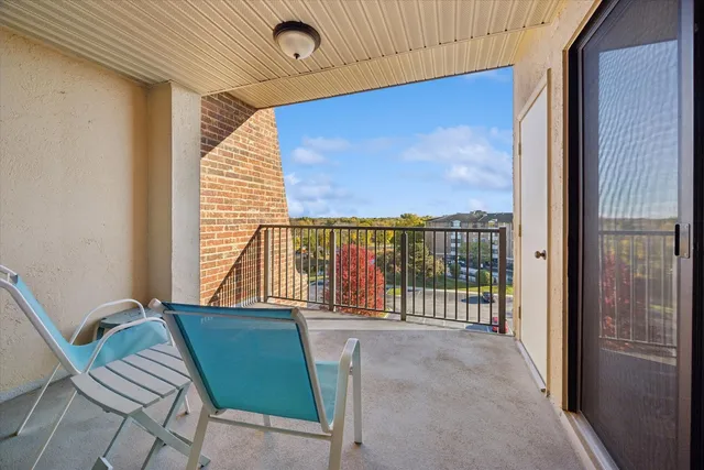 a view of a balcony with furniture
