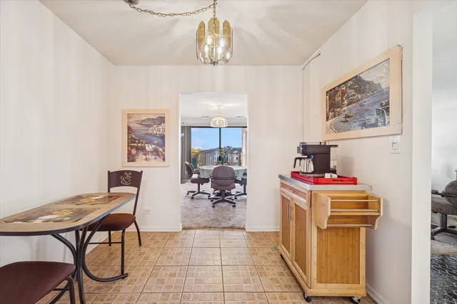 a living room with a couch and a chandelier