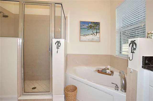 a bathroom with a bathtub and a shower