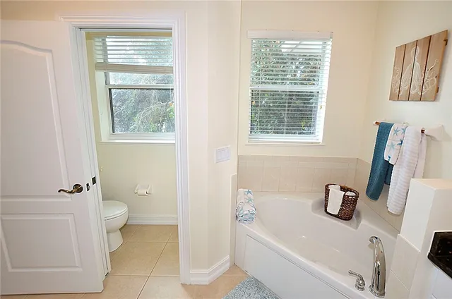 a bathroom with a sink a toilet and a tub