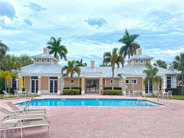 a view of houses with palm trees