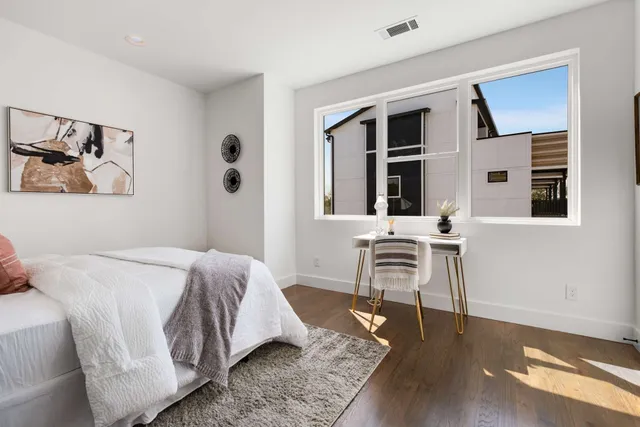 a bed room with a bed and a couch