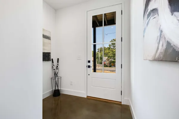 wooden floor with windows and plants
