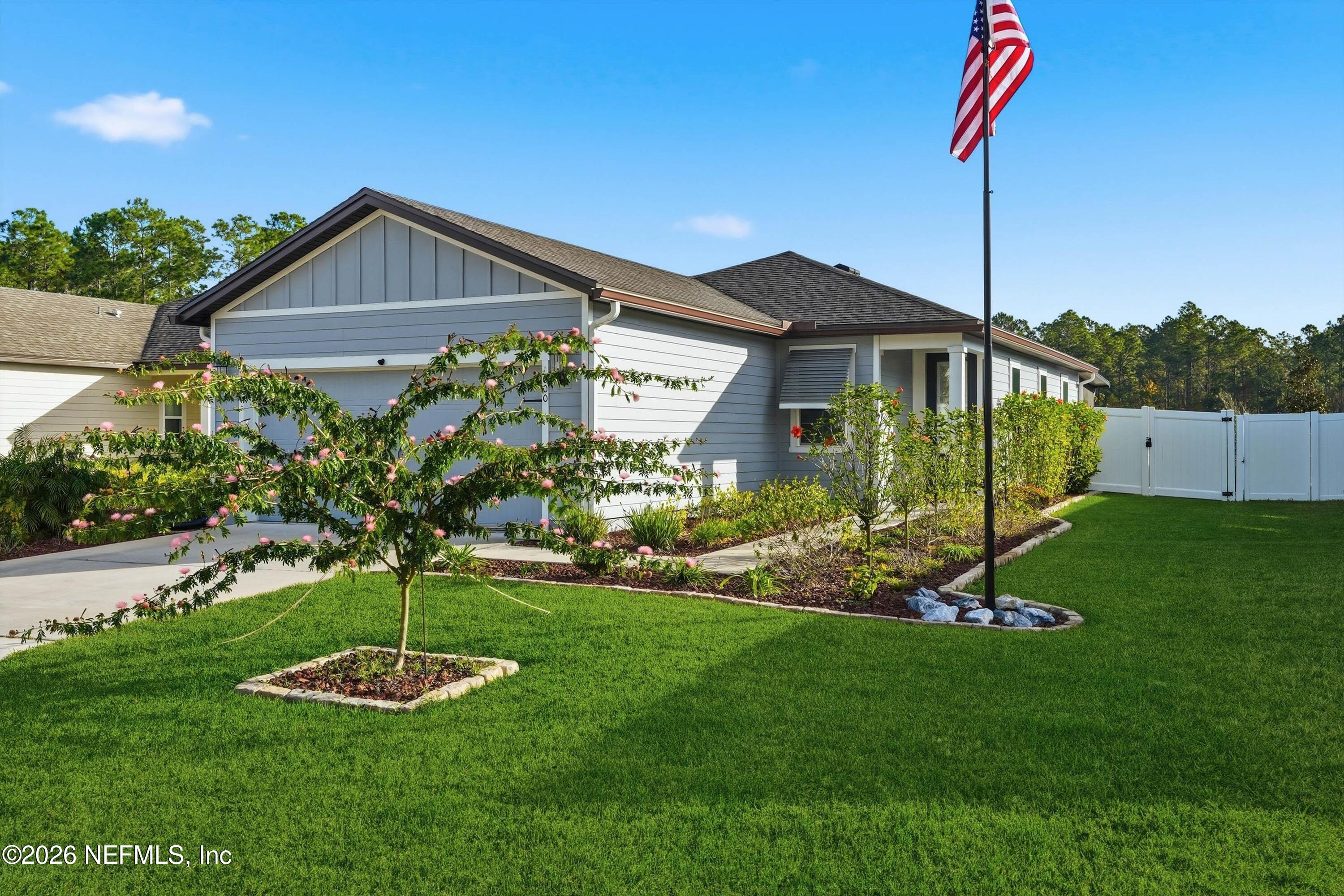 600 Morgans Treasure Road St. Augustine, FL 32084 - Photo 2 of 41 a front view of a house with a yard