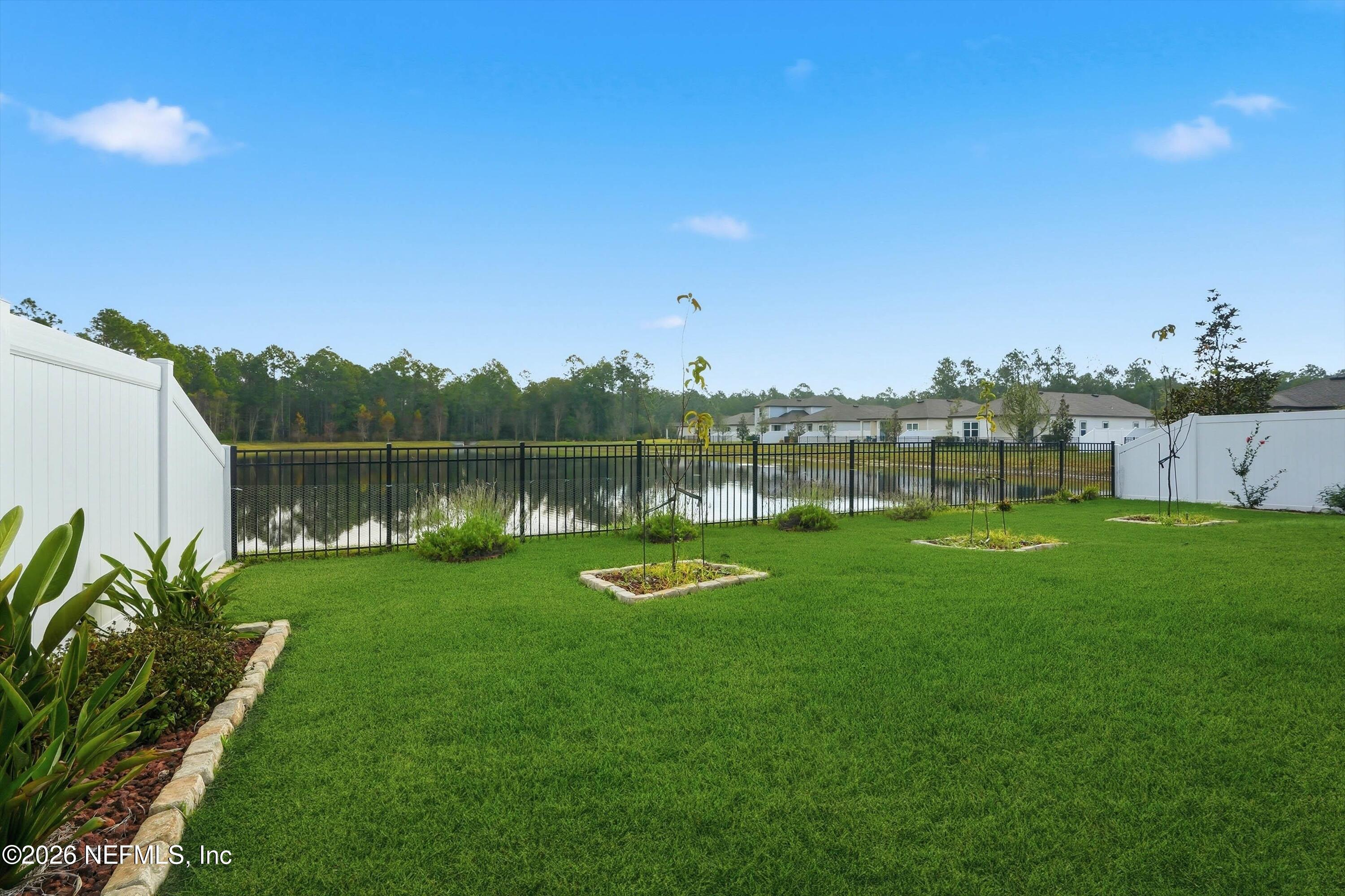 600 Morgans Treasure Road St. Augustine, FL 32084 - Photo 21 of 41 a view of a lake with houses in the back