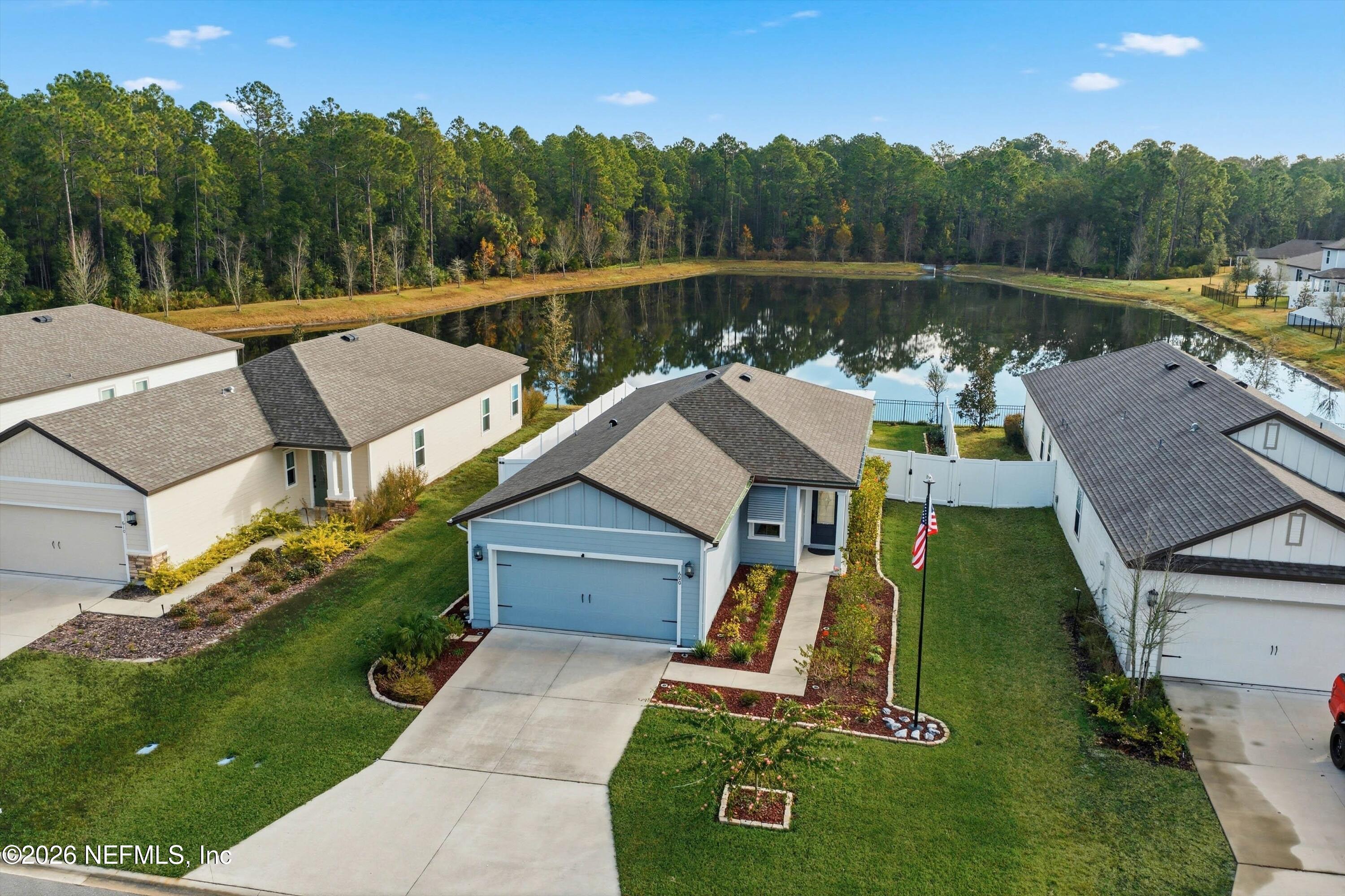 600 Morgans Treasure Road St. Augustine, FL 32084 - Photo 26 of 41 an aerial view of a house with swimming pool and a yard
