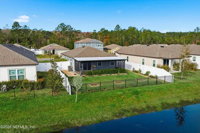 a aerial view of a house with a big yard