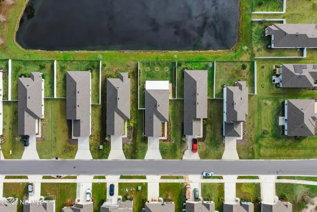 a view of a lake with a yard