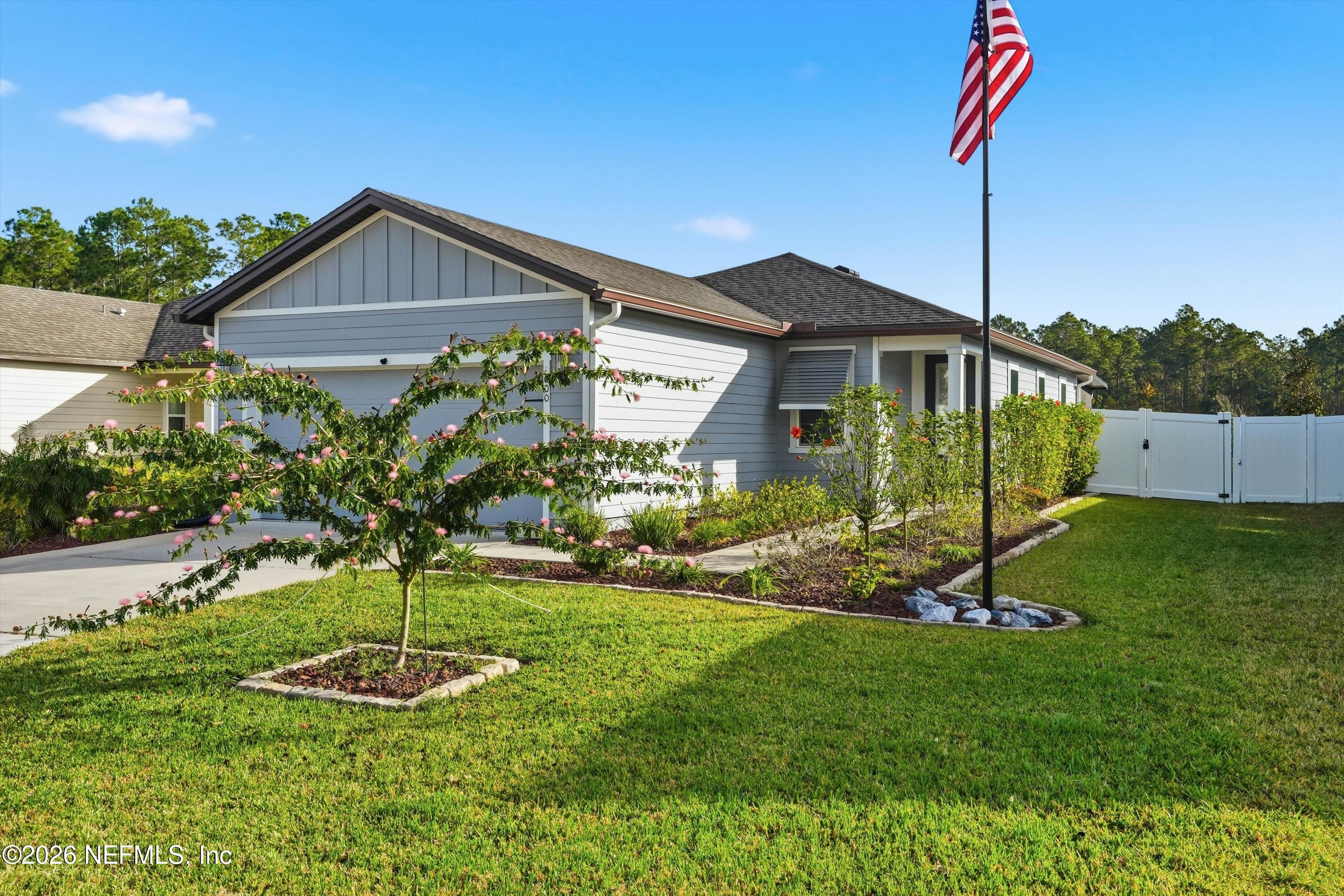 600 Morgans Treasure Road St. Augustine, FL 32084 - Photo 33 of 41 a backyard of a house with a garden and plants