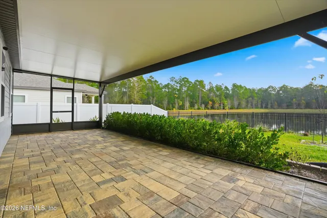 a view of a lake with houses in the back