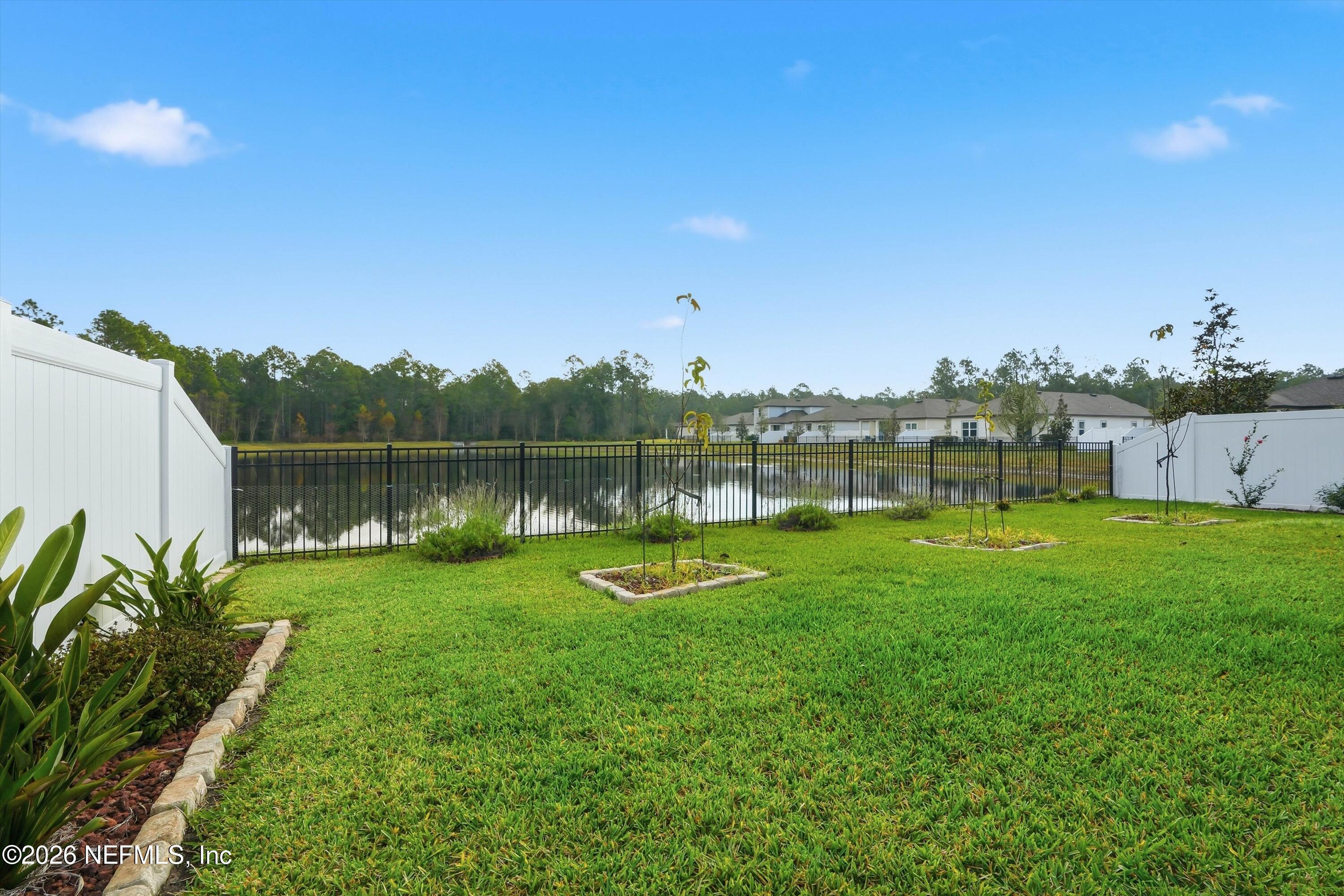 600 Morgans Treasure Road St. Augustine, FL 32084 - Photo 36 of 41 a view of a lake with houses in the back