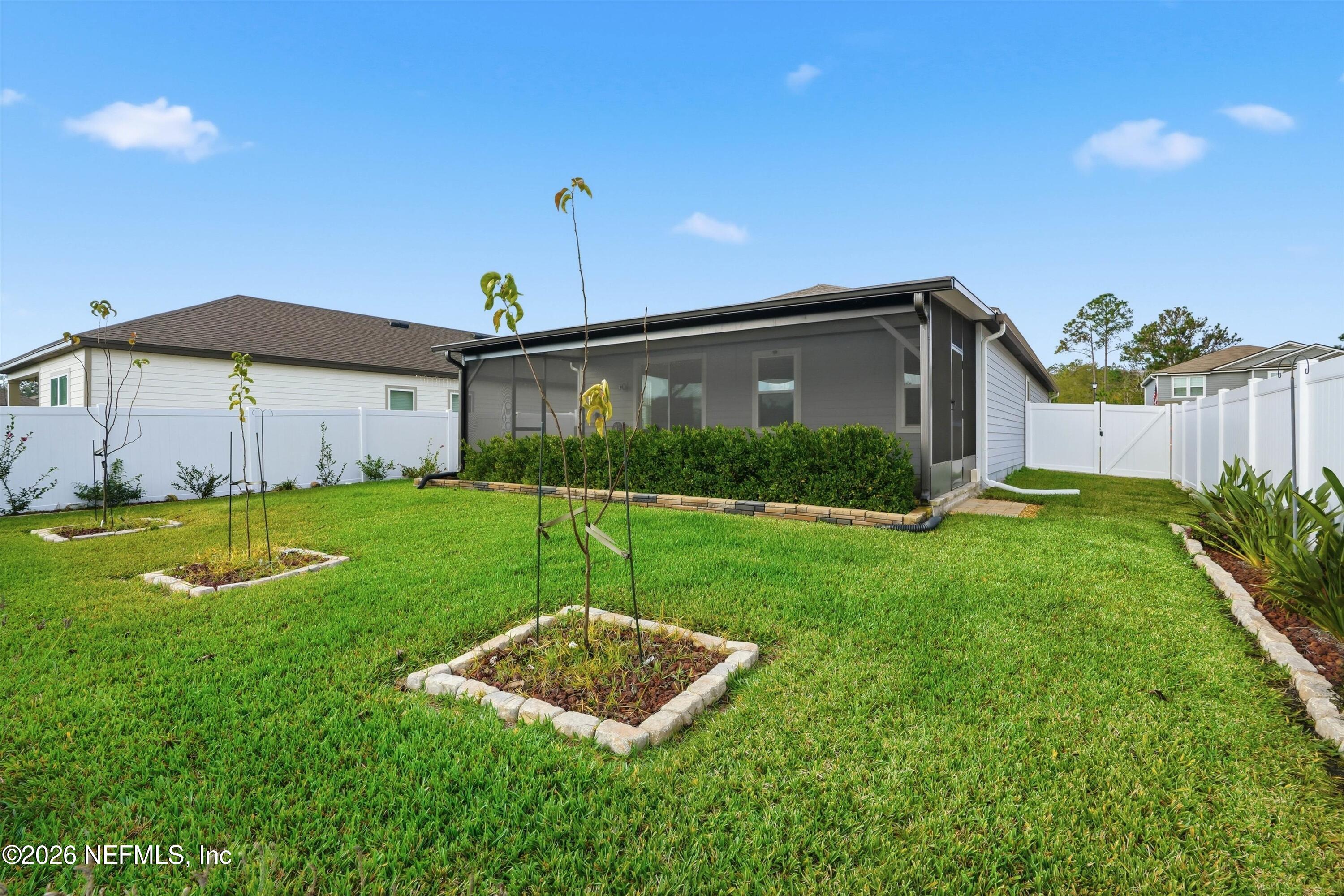 600 Morgans Treasure Road St. Augustine, FL 32084 - Photo 38 of 41 a view of a house with a yard and plants