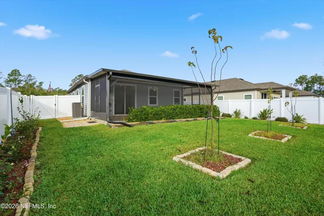 a aerial view of a house with a big yard