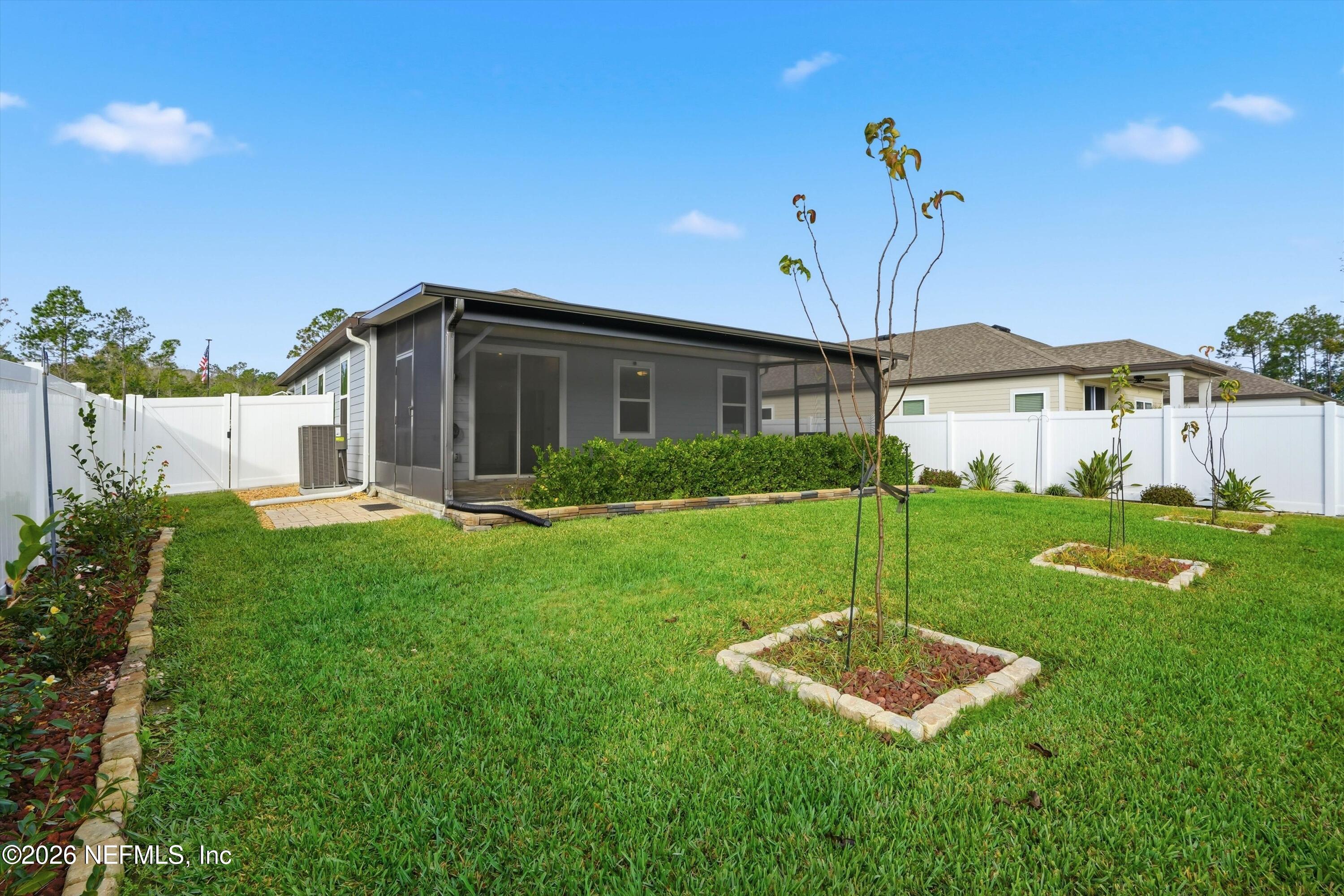 600 Morgans Treasure Road St. Augustine, FL 32084 - Photo 39 of 41 a view of a house with backyard and a garden