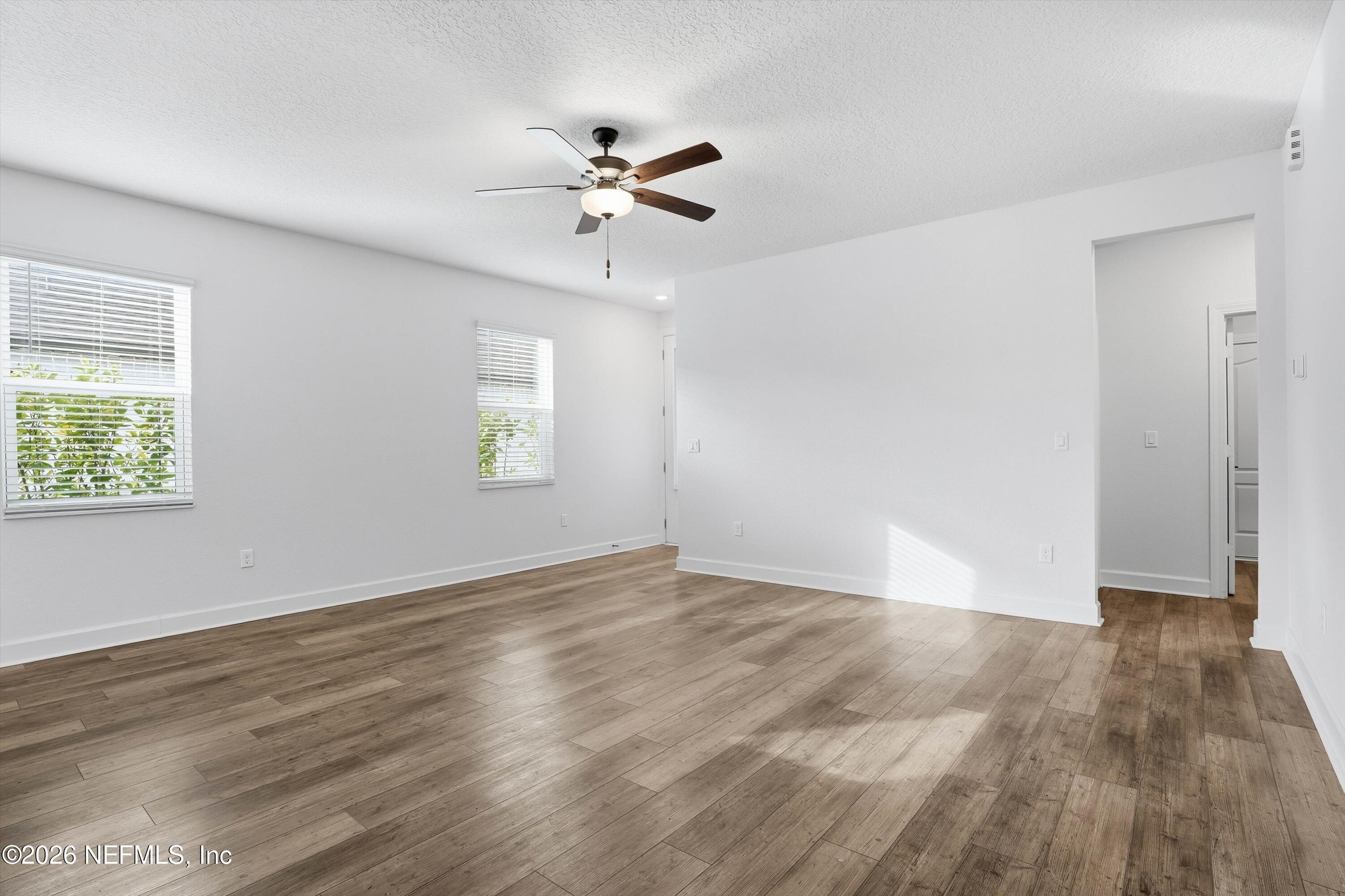 600 Morgans Treasure Road St. Augustine, FL 32084 - Photo 5 of 41 a view of an empty room with wooden floor and a window