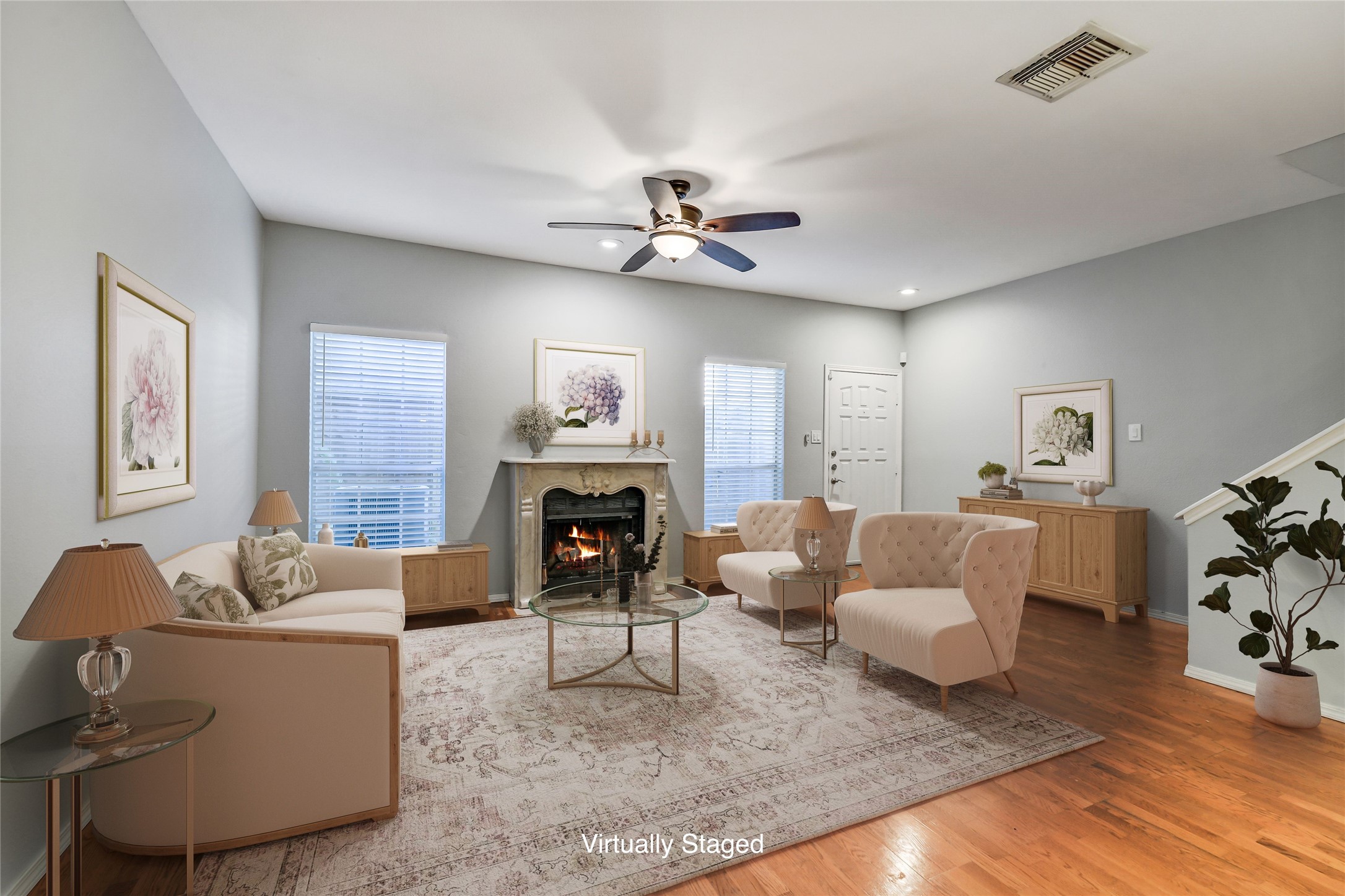 a living room with furniture and a fireplace