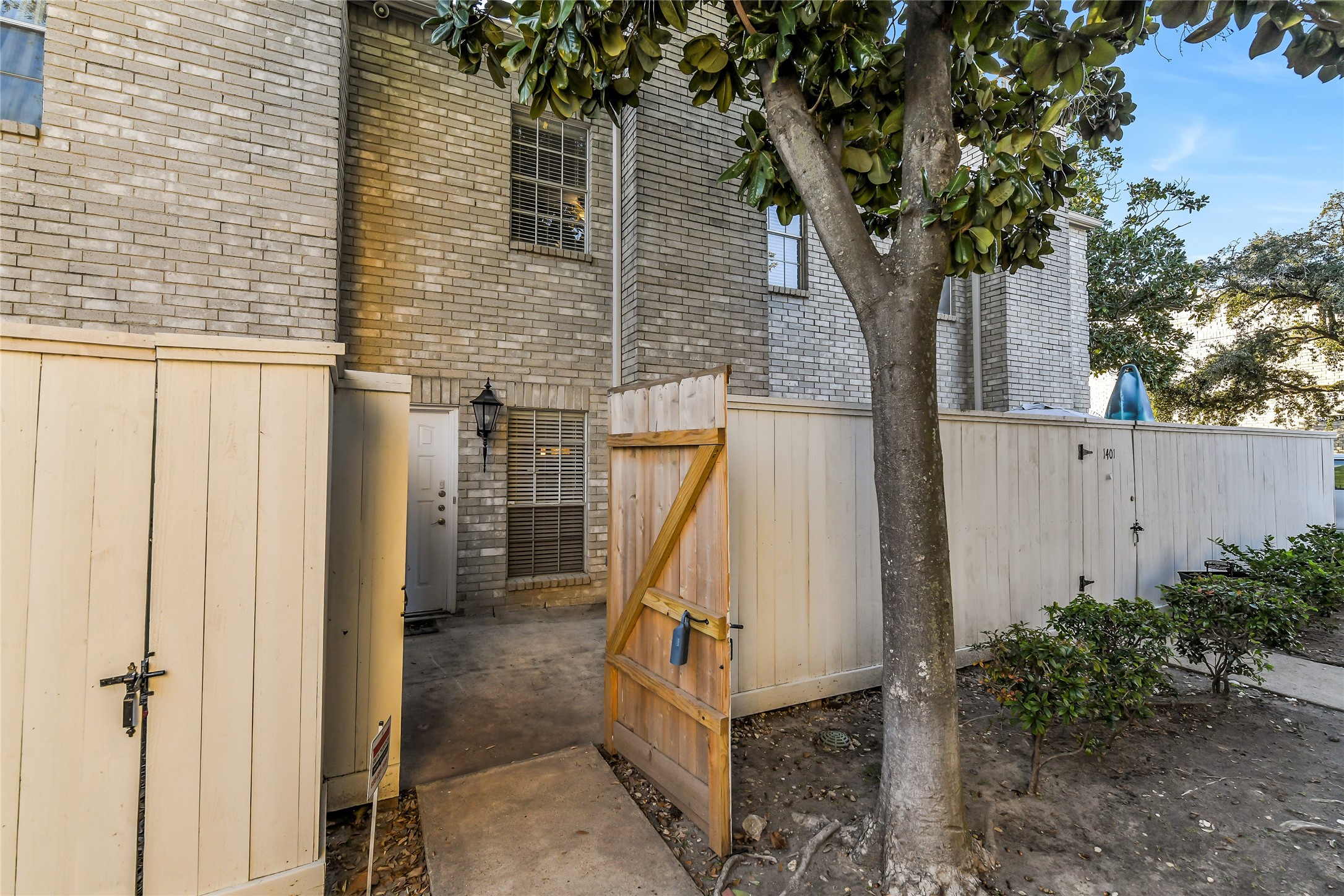 4001 Tanglewilde Street, Unit 1402 Houston, TX 77063 - Photo 3 of 23 a view of a house with a tree