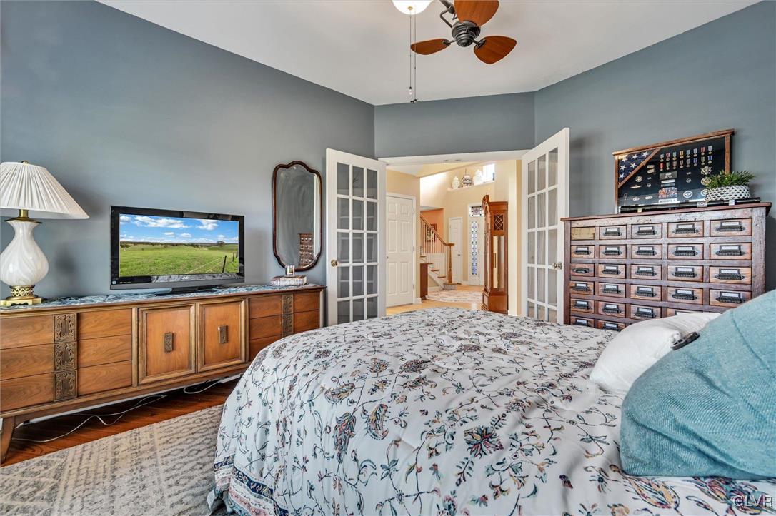 330 Manor Drive Nazareth, PA 18064 - Photo 20 of 51 a bedroom with a bed a dresser and flat screen tv