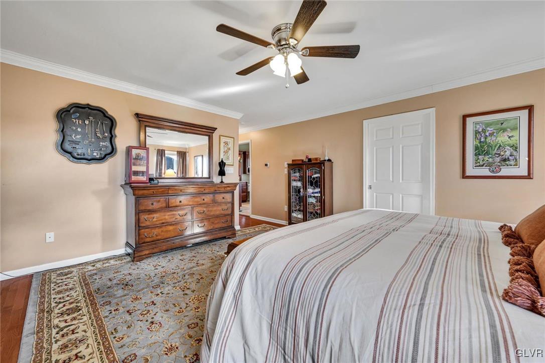 330 Manor Drive Nazareth, PA 18064 - Photo 25 of 51 a bedroom with a large bed and a chandelier