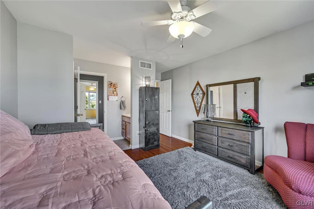 330 Manor Drive Nazareth, PA 18064 - Photo 31 of 51 a bedroom with a bed dresser and wooden floor