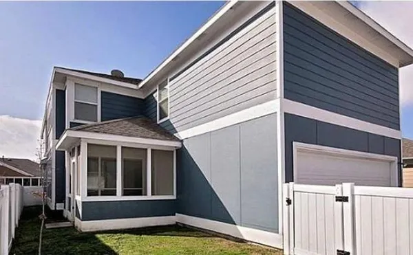 a view of a house with a window and stairs