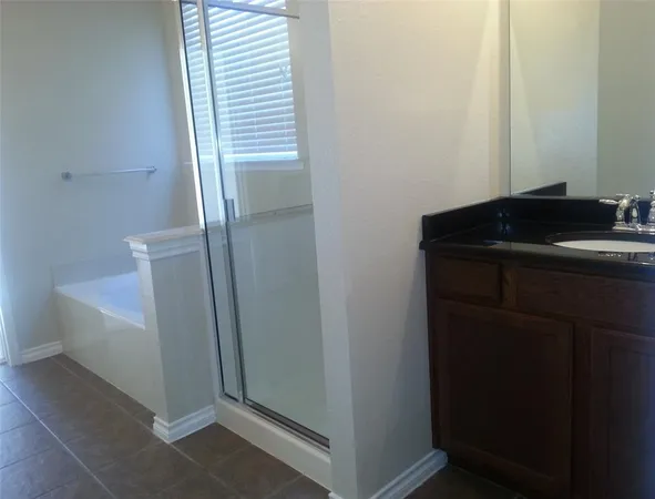 a bathroom with a sink a toilet and tub