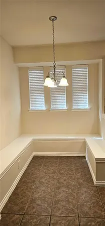a bathroom with a bathtub and window