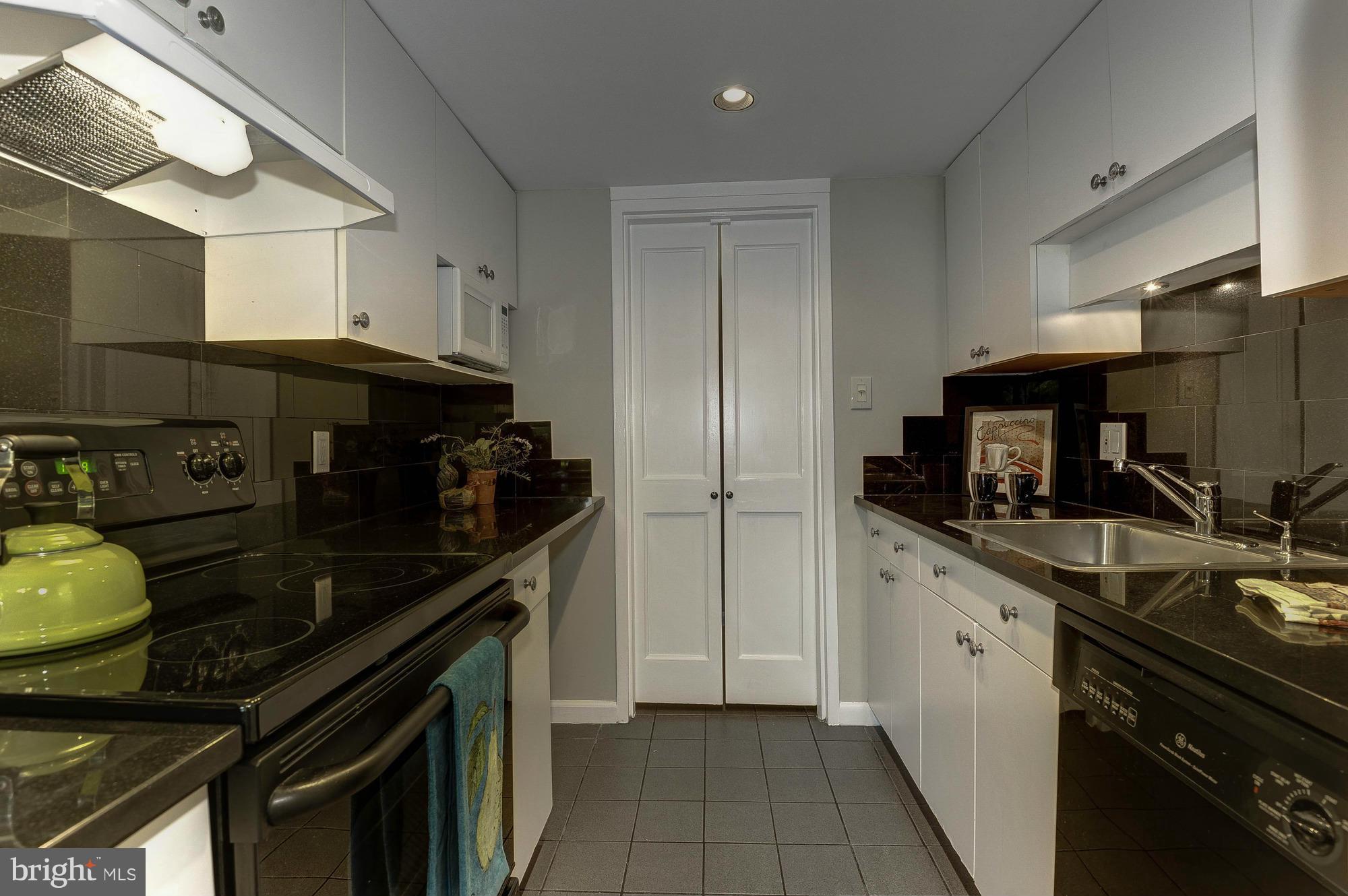 11649 Stoneview Square, Unit 22C Reston, VA 20191 - Photo 23 of 30 Kitchen to Front Entry Hallway
