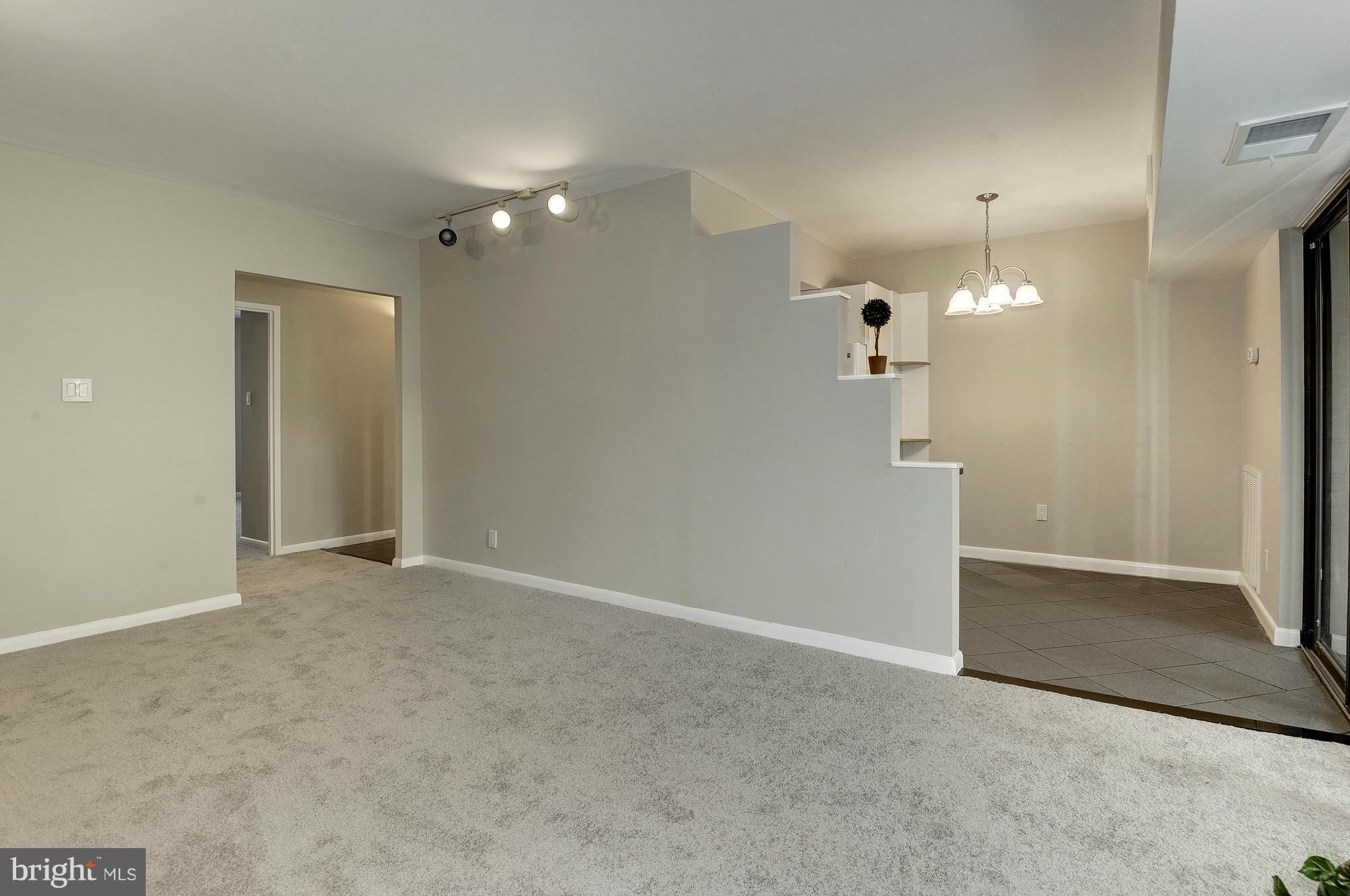 11649 Stoneview Square, Unit 22C Reston, VA 20191 - Photo 10 of 30 Living Room to Dining area