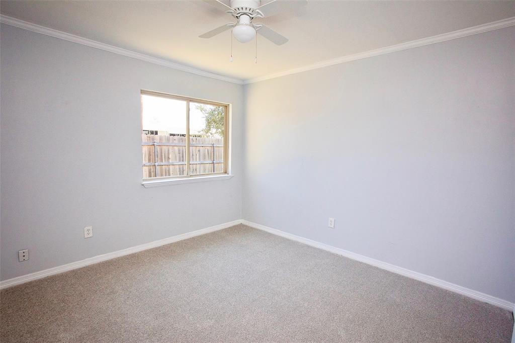 1214 3rd Street Graham, TX 76450 - Photo 16 of 23 an empty room with a window