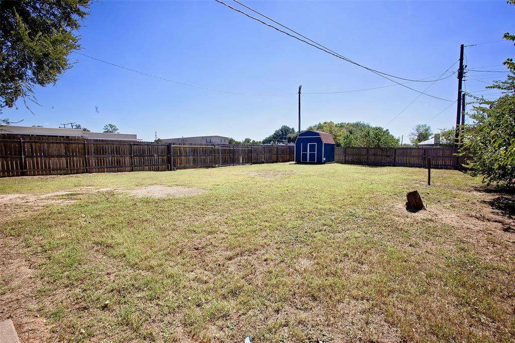 1214 3rd Street Graham, TX 76450 - Photo 20 of 23 a view of an outdoor space and a yard