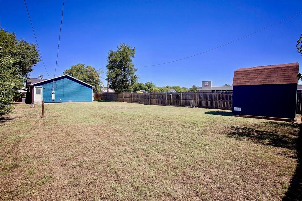 1214 3rd Street Graham, TX 76450 - Photo 22 of 23 a view of a house with a yard