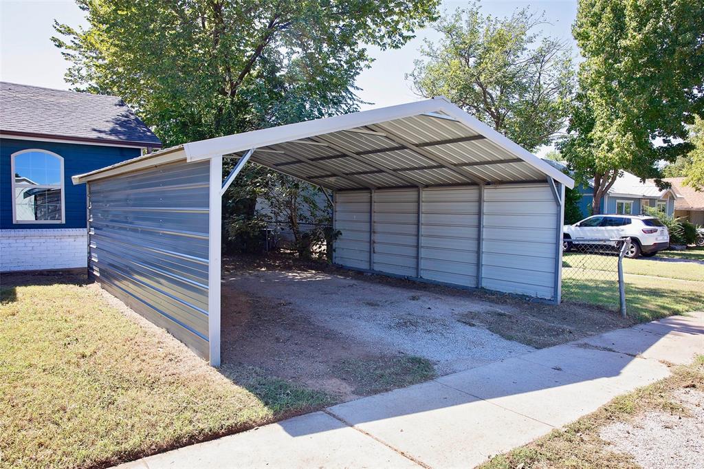 1214 3rd Street Graham, TX 76450 - Photo 6 of 23 a view of a backyard