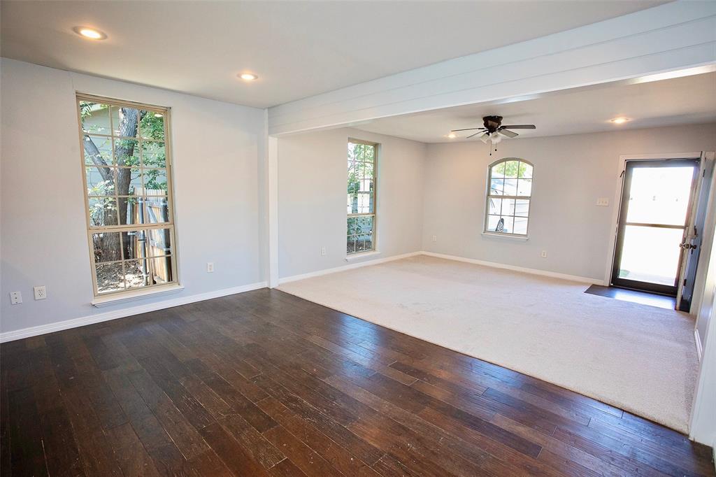 1214 3rd Street Graham, TX 76450 - Photo 8 of 23 a view of empty room with wooden floor and fan