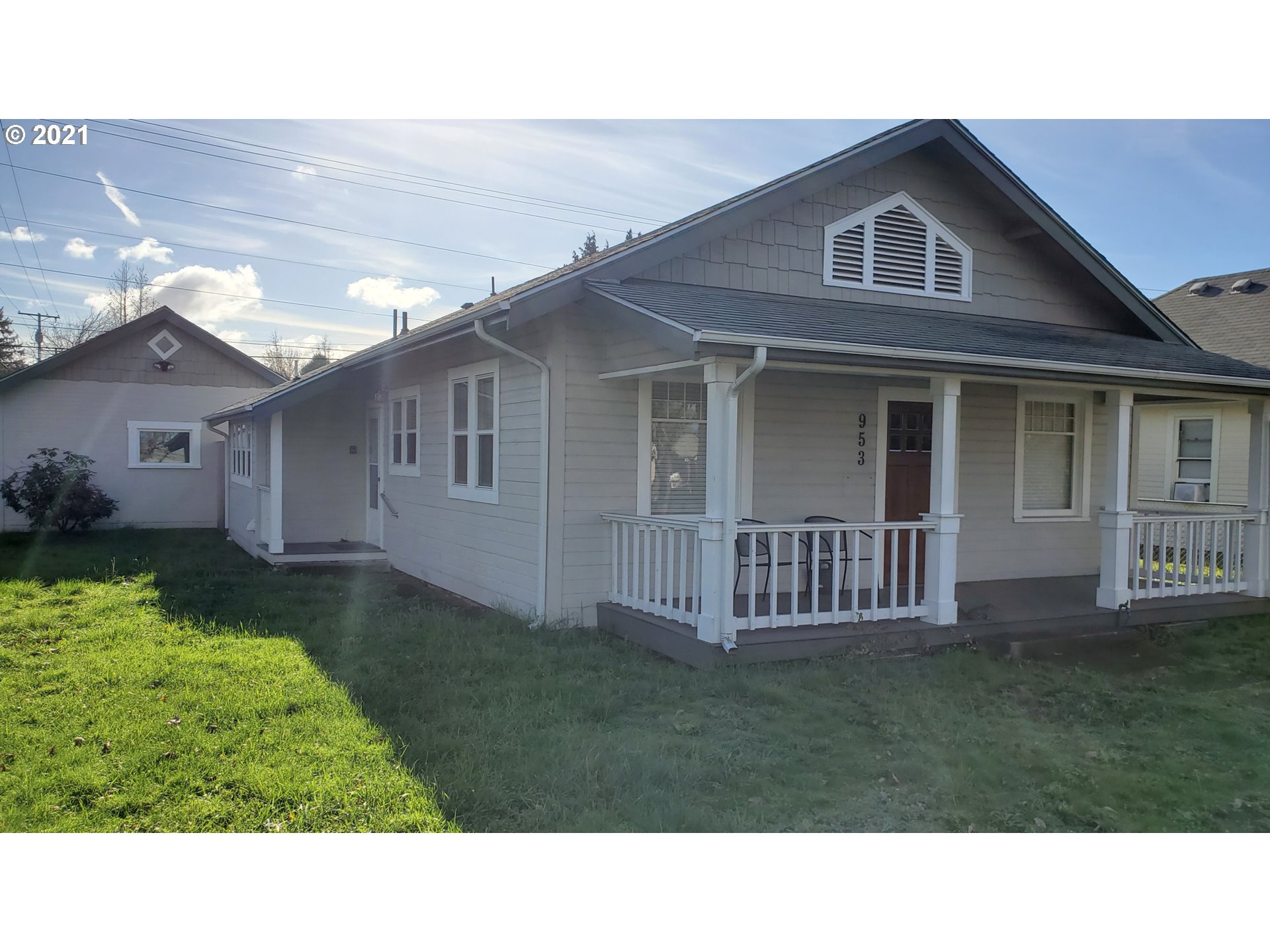 953 E Street Springfield, OR 97477 - Photo 1 of 1 a black and white house with a yard