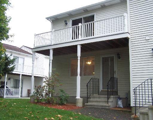 22 Triangle Street, Unit B10 Danbury, CT 06810 - Photo 1 of 1 front view of a house with a yard
