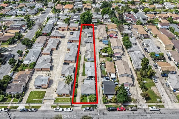 an aerial view of residential houses with outdoor space
