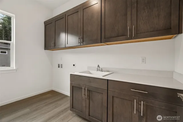 a kitchen with a sink and cabinets