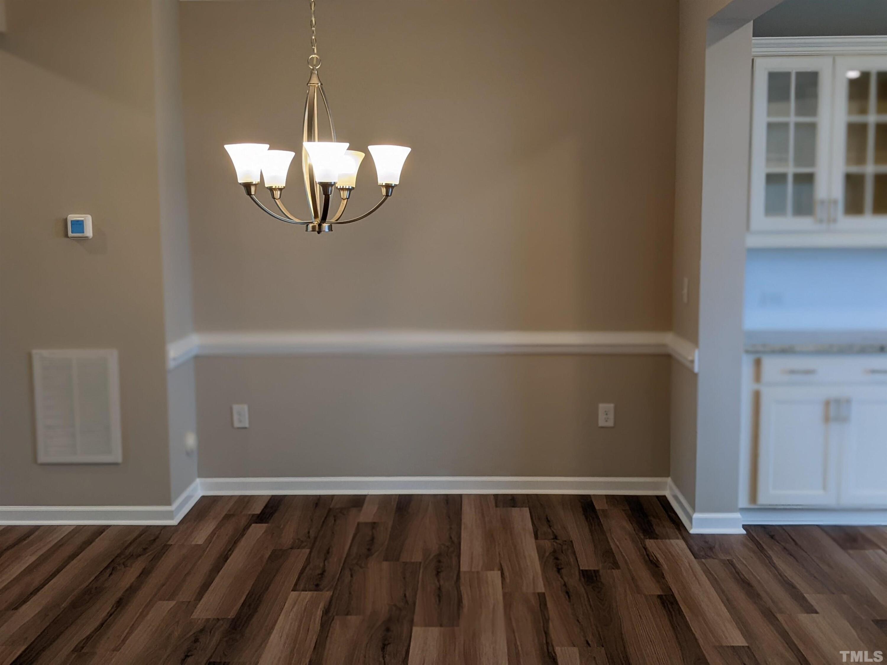 1976 Austin Ridge Parkway Wake Forest, NC 27587 - Photo 11 of 21 a view of a room with wooden floor and windows