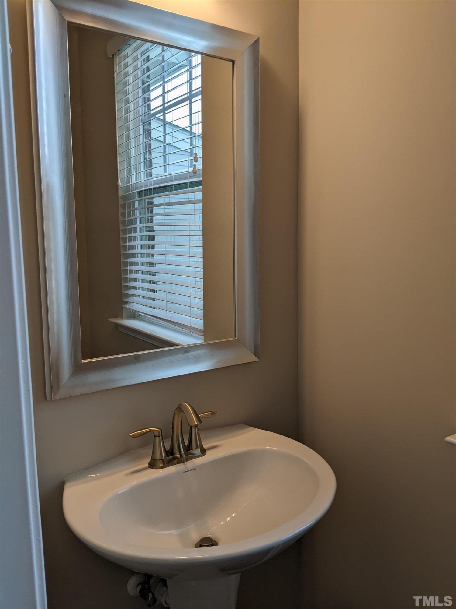 1976 Austin Ridge Parkway Wake Forest, NC 27587 - Photo 13 of 21 a bathroom with a sink and a window