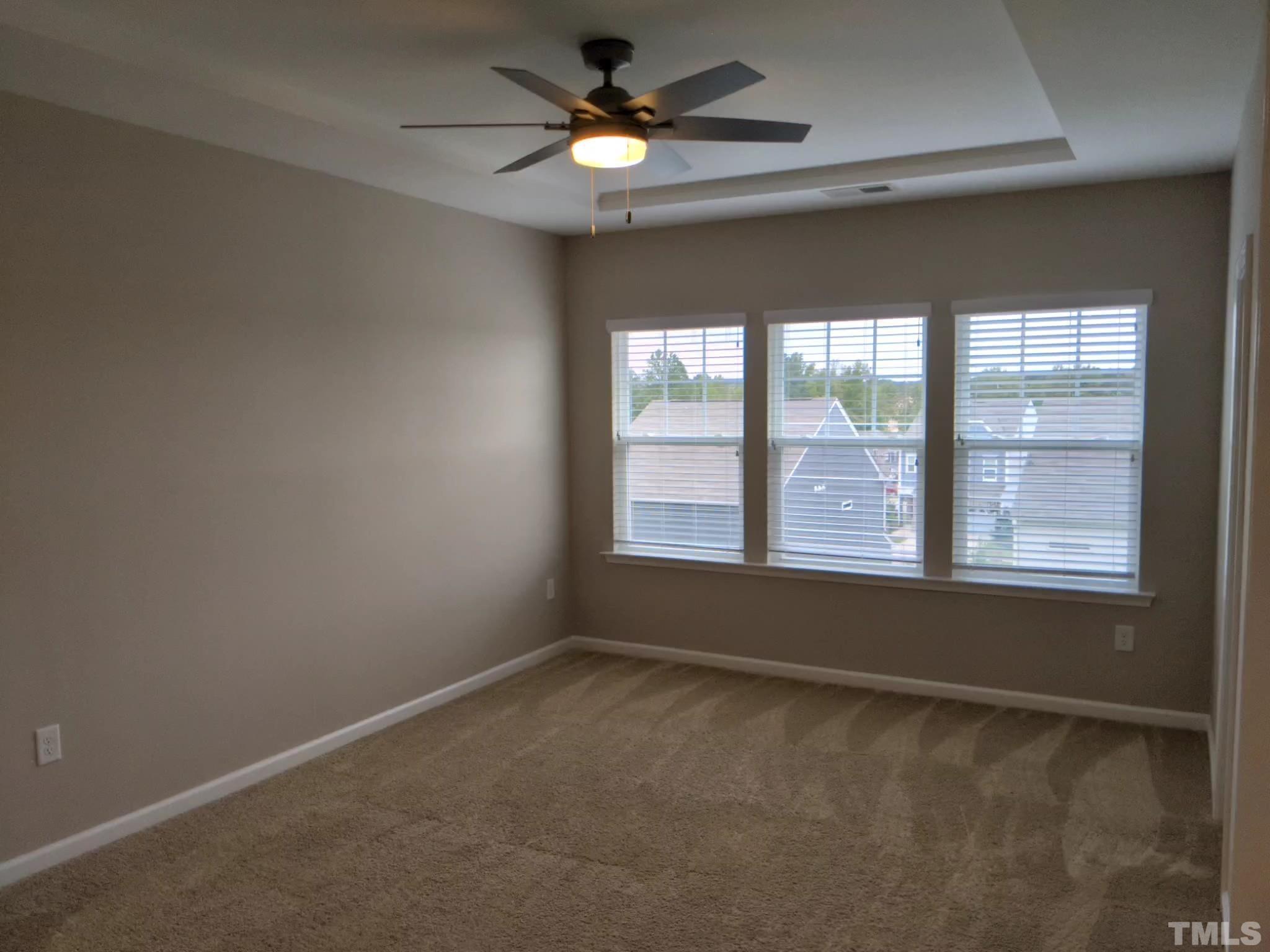 1976 Austin Ridge Parkway Wake Forest, NC 27587 - Photo 14 of 21 an empty room with a window and a fan