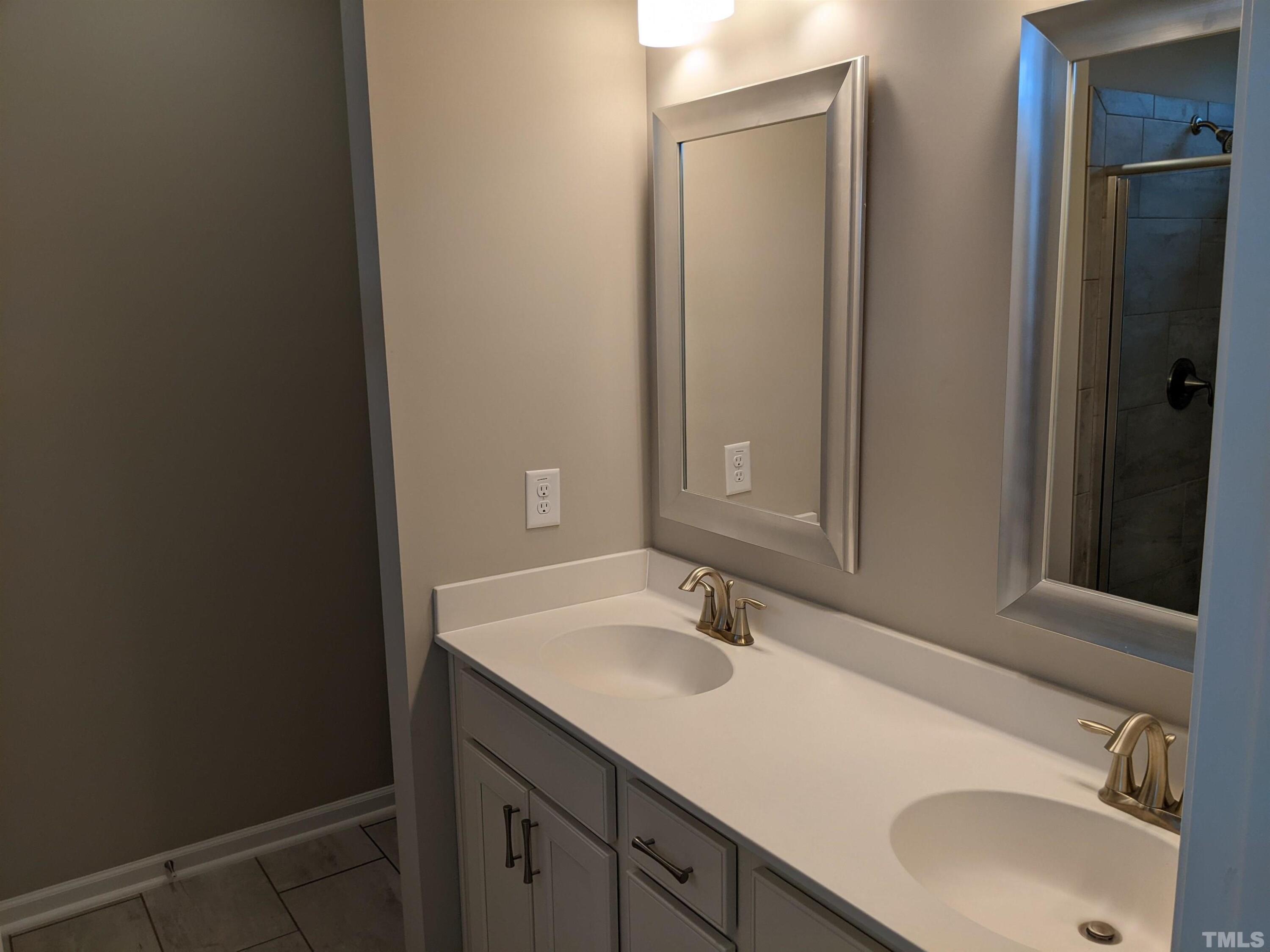 1976 Austin Ridge Parkway Wake Forest, NC 27587 - Photo 15 of 21 a bathroom with a sink and a mirror