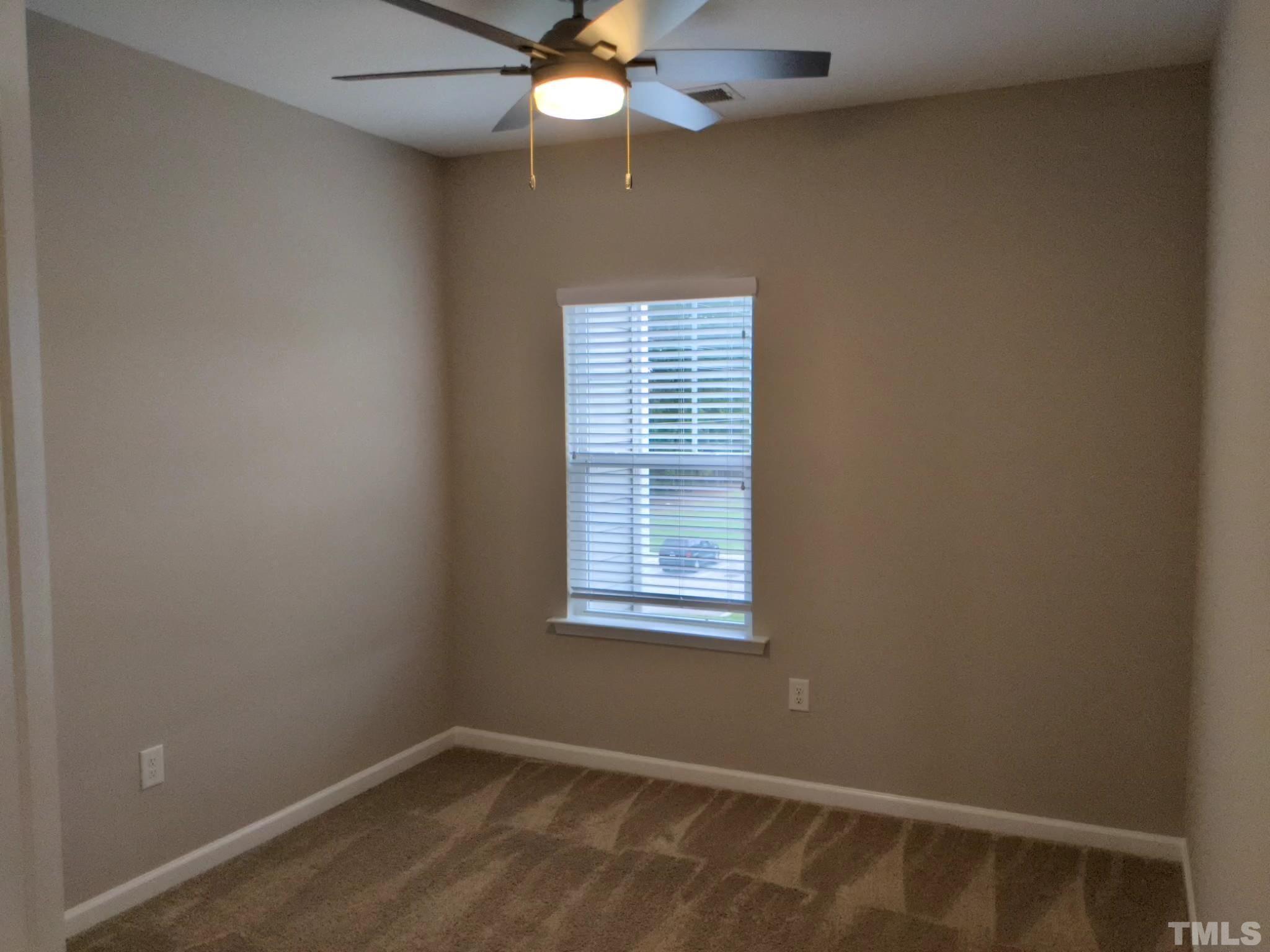 1976 Austin Ridge Parkway Wake Forest, NC 27587 - Photo 19 of 21 an empty room with a window and a fan