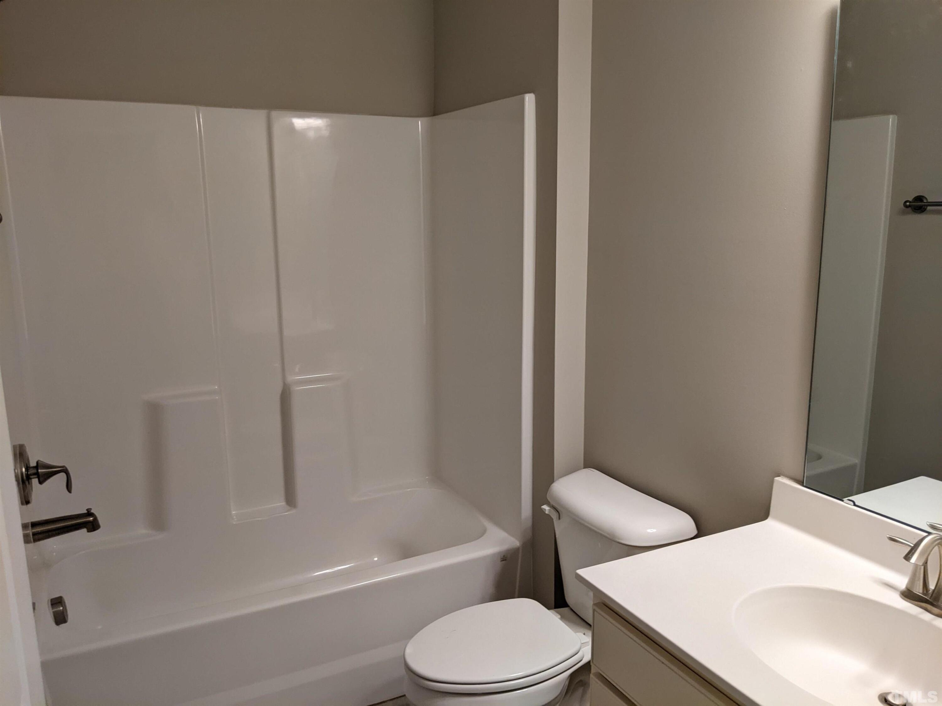 1976 Austin Ridge Parkway Wake Forest, NC 27587 - Photo 20 of 21 a bathroom with a toilet a sink and bathtub
