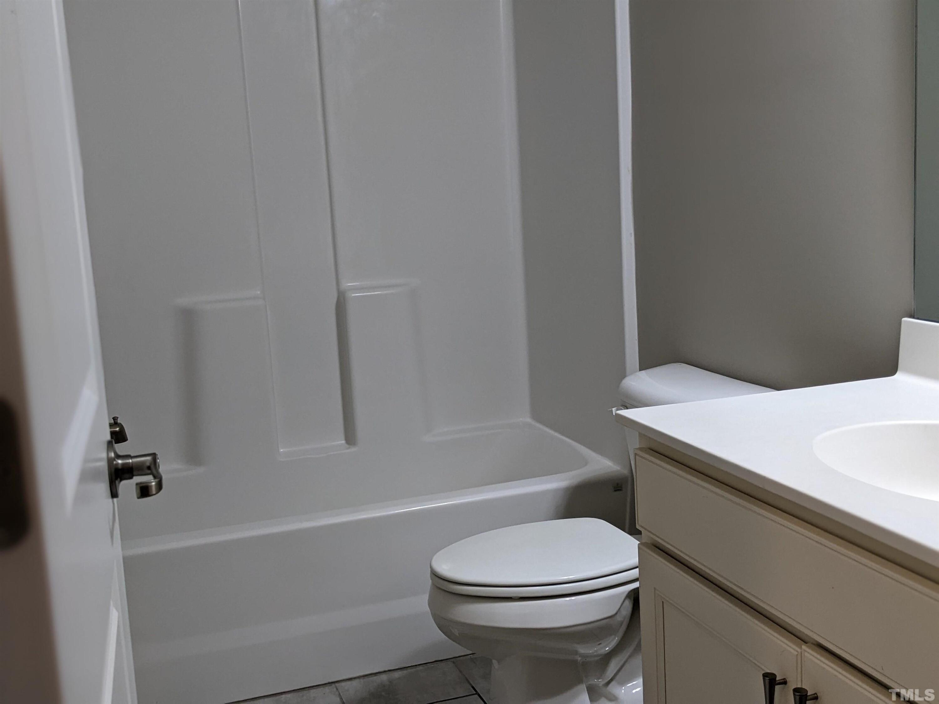 1976 Austin Ridge Parkway Wake Forest, NC 27587 - Photo 4 of 21 a bathroom with a sink a toilet and bathtub