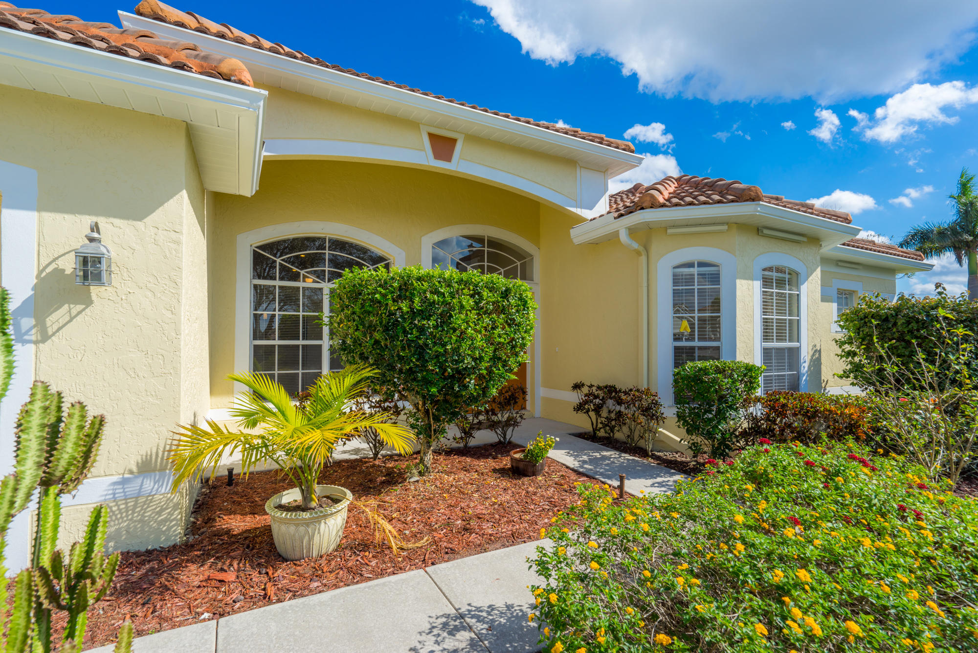 567 Southwest Spring Hill Point Port St. Lucie, FL 34986 - Photo 1 of 36 a front view of a house with a chairs