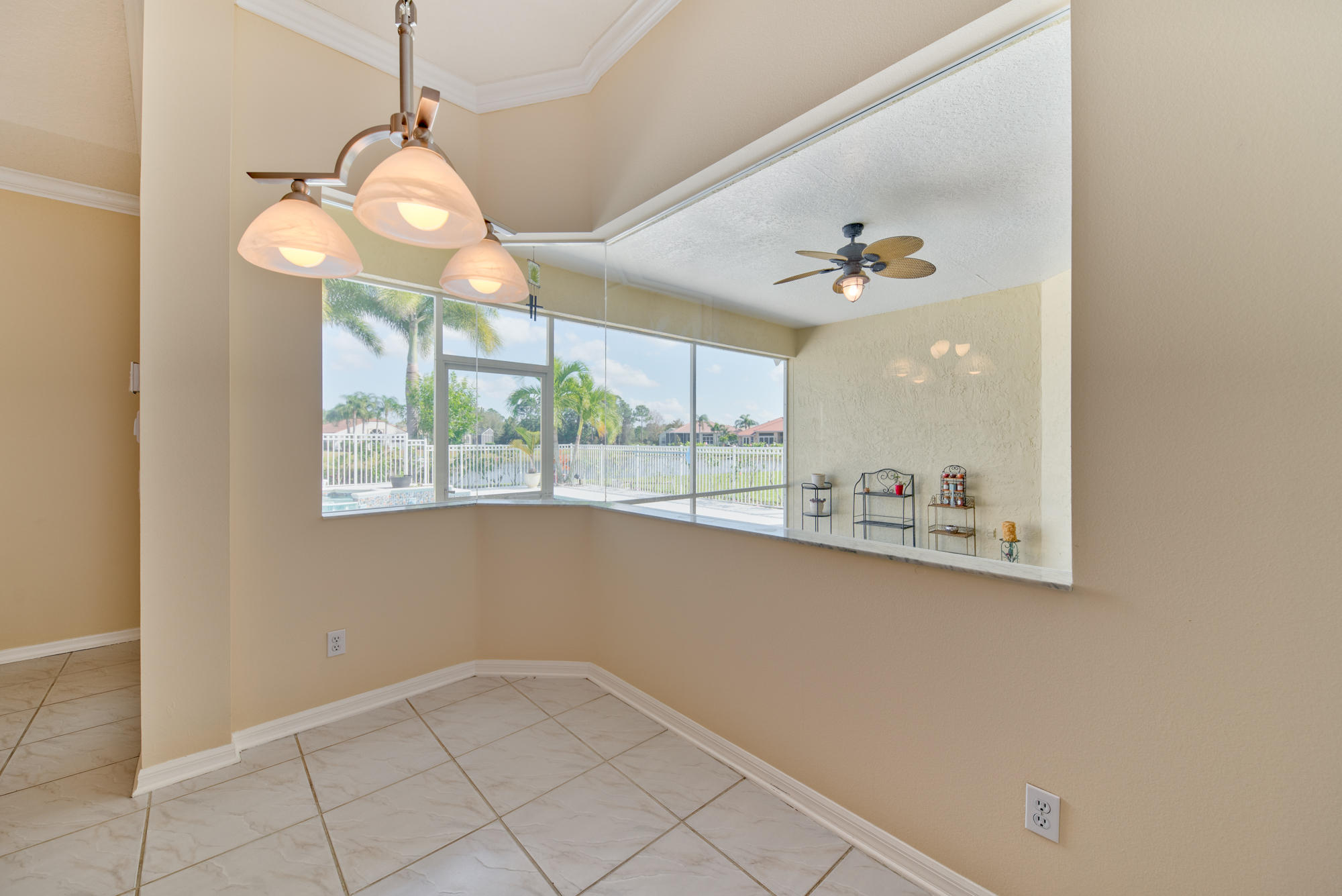 567 Southwest Spring Hill Point Port St. Lucie, FL 34986 - Photo 12 of 36 a view of a kitchen from the hallway